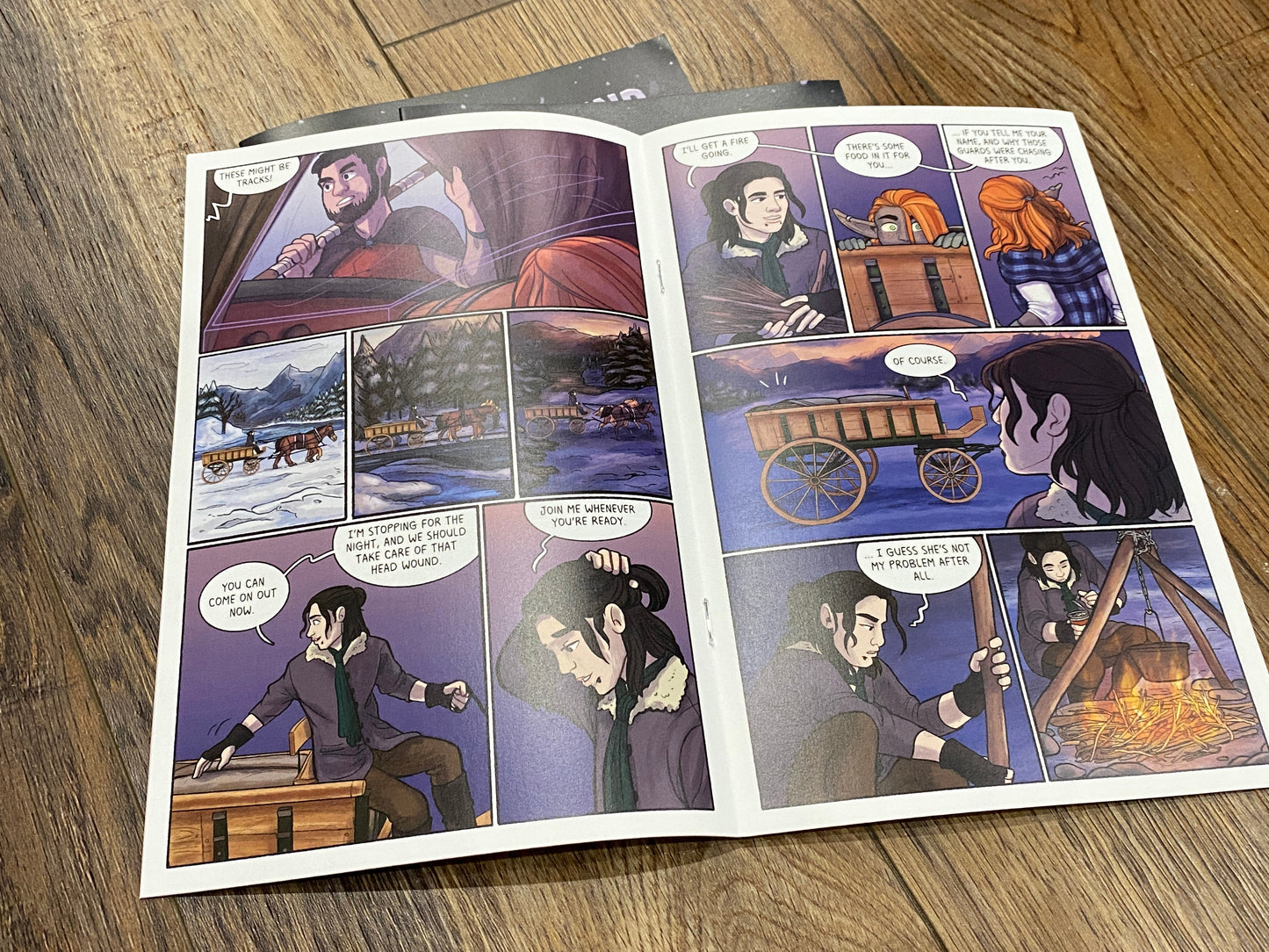 Third page: An open page view of a spread of comic panels of the printed version.